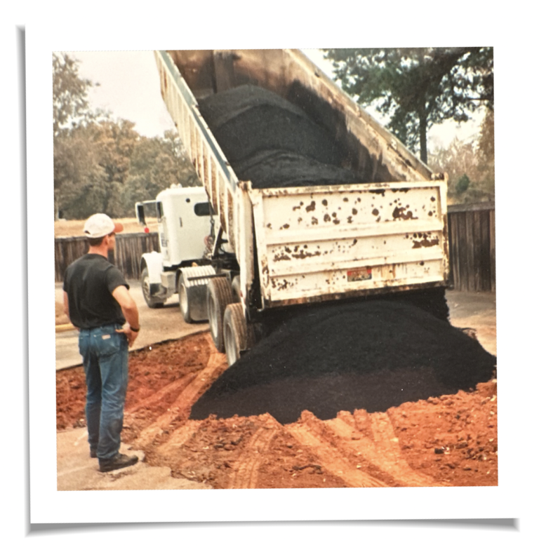 Mark Young of Kenmar Paving watching asphalt being delivered to a jobsite in 1992 in East Texas.